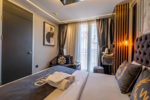 En eller flere senge i et værelse på The Wind Beşiktaş