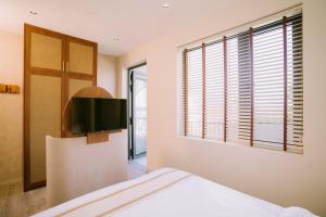 TV a/nebo společenská místnost v ubytování Chingu Boutique Vũng Tàu