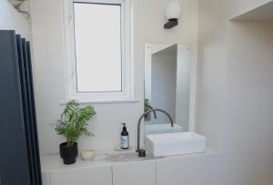a bathroom with a sink and a mirror at Carmona Bank in Dunoon +25 photos