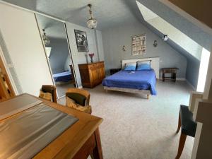 En eller flere senge i et værelse på Le Clos Brizeux