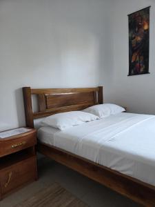 Postel nebo postele na pokoji v ubytování Passadeira Garden