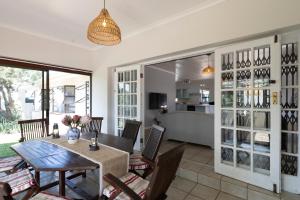 a dining room with a table and chairs at Sea Bliss in Kenton on Sea