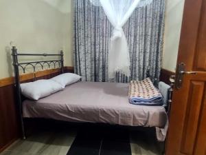 Ένα ή περισσότερα κρεβάτια σε δωμάτιο στο Jinas Haven