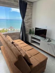 Et tv og/eller underholdning på Flat Mirante Alto do Cruzeiro