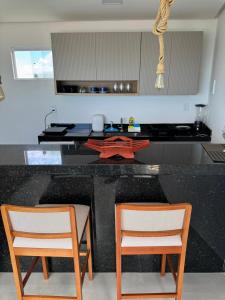 Køkken eller tekøkken på Flat Mirante Alto do Cruzeiro