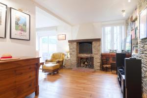 Posezení v ubytování Le Dérochoir - Avec jardin