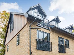 a house with a balcony on top of it at The Loft At St John's in York