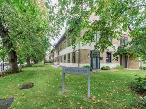 a sign in the grass in front of a building at The Loft At St John's in York +27 photos