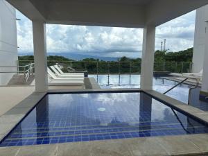 a swimming pool in a house with a view at Ocean Verde Suite Boracay in Boracay