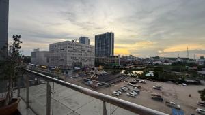 a city with cars parked in a parking lot at NAGA Frontier Apartment in Vientiane
