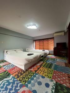 Postel nebo postele na pokoji v ubytování ゲストハウス椙乃家