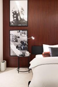 a bedroom with a bed and a picture of a football helmet at The F1 Scene Designer Apartment With120 Inch in Yas Island