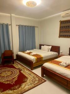 Postel nebo postele na pokoji v ubytování Meet Sunset Villa Luang Prabang