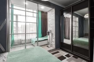 En eller flere senge i et værelse på В центре с дополнительным спальным местом