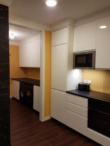 Η κουζίνα ή μικρή κουζίνα στο Am Apartments