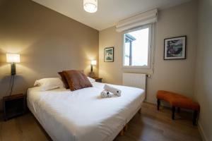 Giường trong phòng chung tại La résidence du lac +2 ảnh