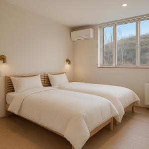 Voodi või voodid majutusasutuse Kizen Kimobetsu toas