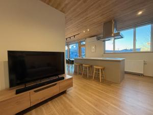 Televiisor ja/või meelelahutuskeskus majutusasutuses Kizen Kimobetsu