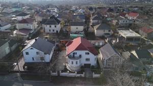 an aerial view of a residential neighborhood with houses at Bazin interior 3 dormitoare Cricova in Cricova