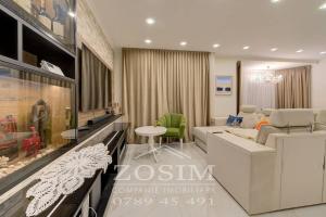 a living room with a couch and a table at Bazin interior 3 dormitoare Cricova in Cricova