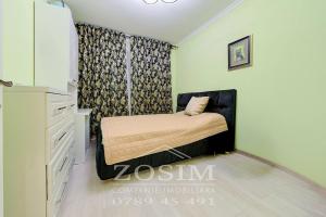 a small bedroom with a bed and a dresser at Bazin interior 3 dormitoare Cricova in Cricova +10 photos