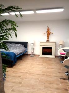 a bedroom with a bed and a fireplace at FeApp Souterrain Pennen & Parken in Mondsee +22 photos