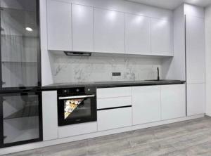 Kuchyň nebo kuchyňský kout v ubytování Modern Apartment