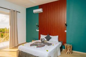 Giường trong phòng chung tại Sunset Villa Kidoti +13 ảnh