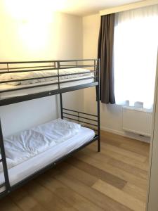 Voodi või voodid majutusasutuse Ferienwohnung Design Chalet In Bad Kleinkirchheim toas