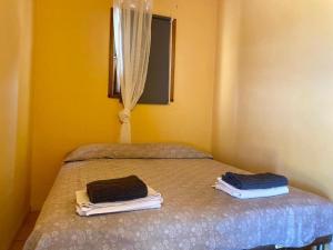 Ένα ή περισσότερα κρεβάτια σε δωμάτιο στο Country House Biobonizio