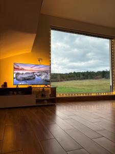 a room with a large window with a large screen at Villa Marija in Livno +18 photos