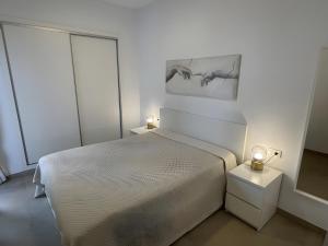 Postel nebo postele na pokoji v ubytování Apartment Building Copenhagen,Nerja