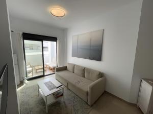 TV a/nebo společenská místnost v ubytování Apartment Building Copenhagen,Nerja