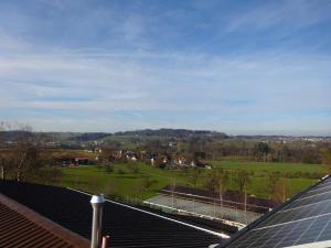 a group of solar panels on top of a roof at Rehalp Westen in Bischofszell
