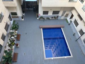 an overhead view of a swimming pool in a building at Studio Stadium morocco for family in Mohammedia