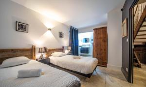 Postel nebo postele na pokoji v ubytování L'Atelier des Rêves