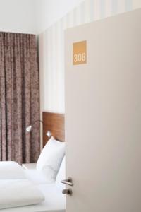 Postel nebo postele na pokoji v ubytování Seehörnle Bio Hotel & Gasthaus