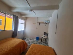 Una cama o camas en una habitación de Hostal Casa Gavilán 62 fotos más