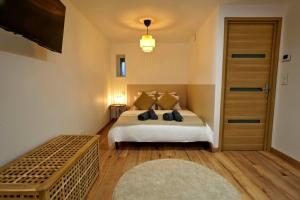 Postel nebo postele na pokoji v ubytování Le Cocon d'Obernai