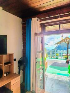 a living room with a sliding glass door to a patio at Nature Rock Ella in Ella +52 photos