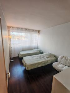 Una cama o camas en una habitación de La Fresque