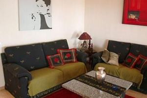 a living room with a couch and a table at Casa Alhambra 4 6 P in Guía de Isora