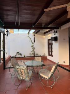 a patio with a table and chairs in a room at Babela 1 in Concordia +20 photos