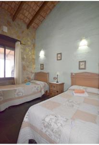 Ένα ή περισσότερα κρεβάτια σε δωμάτιο στο Mirador de Fuentes