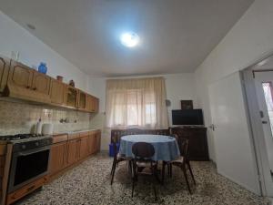 a kitchen with a table and chairs in it at CasaMiria in Seravezza