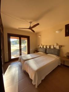 Una cama o camas en una habitación de Sa Rondalla - Formentera