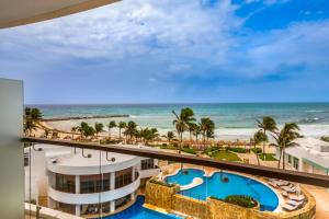 a view of the beach from the balcony of a resort at Krystal Grand Cancun All Inclusive in Cancún