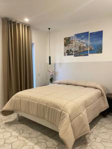 Ένα ή περισσότερα κρεβάτια σε δωμάτιο στο Domus Fontana