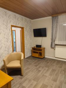 TV a/nebo společenská místnost v ubytování Gästehaus Atrico Haus 106