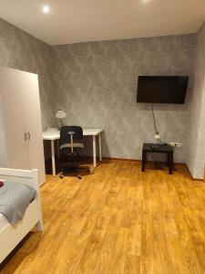 TV a/nebo společenská místnost v ubytování Gästehaus Atrico Haus 106 + 7 fotografií